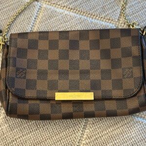 LOUIS VUITTON
Favorite PM Damier Ebene Crossbody Bag Brown